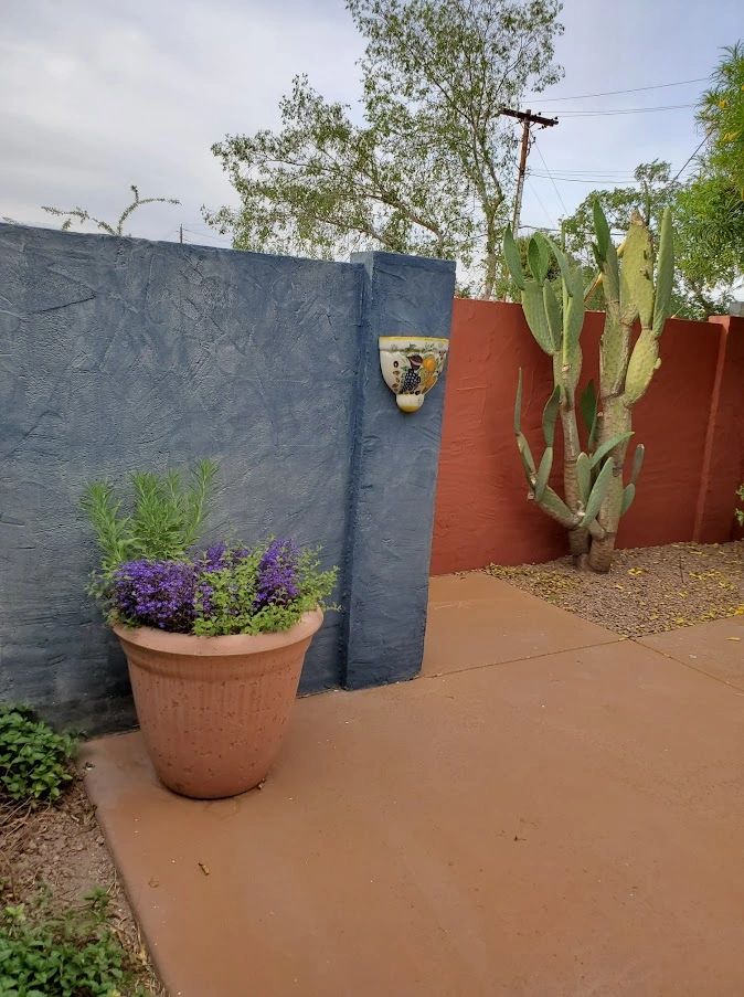 Exterior fence painting — Southwest style